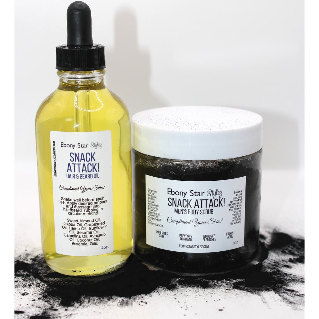 Two skincare products, 'SNACK ATTACK! Beard Oil' in a clear bottle with a black dropper and 'SNACK ATTACK! Body Scrub' in a white container with a black label, both with branding and information on the labels.