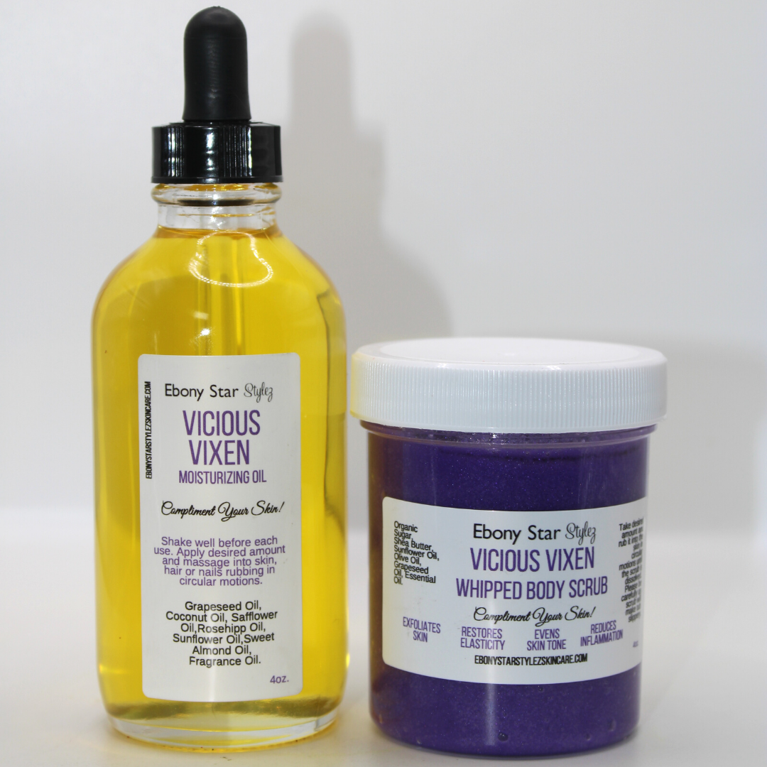 A set of two skin care products, a yellow body scrub and a clear moisturizing oil, both labeled 'Ebony Star Stylez' with tropical-themed fragrances mentioned on the labels.